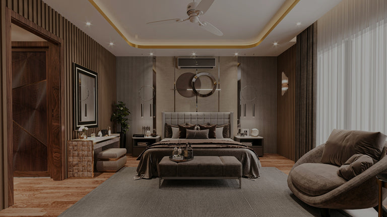 Modern bedroom with gray bed, armchair, and wooden floor.